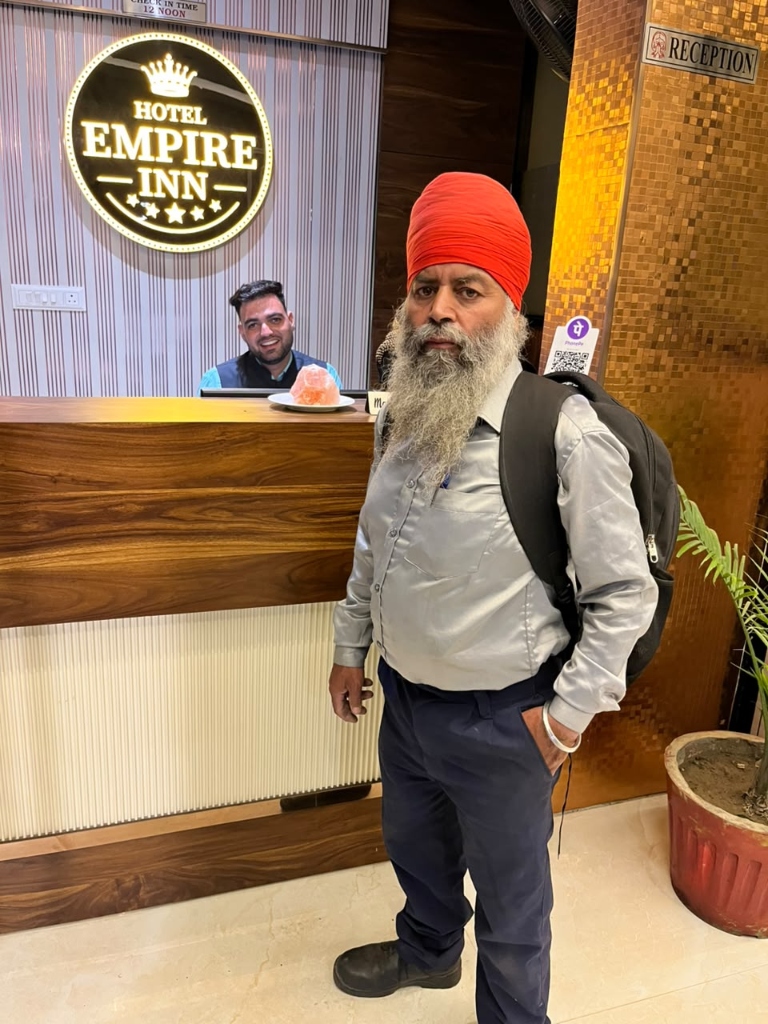 OPC technician at Hotel Empire Inn reception desk